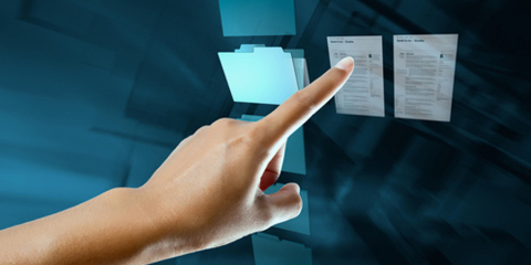 Hand pointing at documents